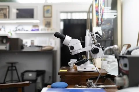 Optical equipment for precision work in a workshop Stock Photos