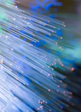 Optical fibres dinamic flying from deep on technology background Stock Photos