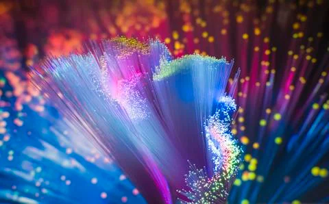 Optical fibres dinamic flying from deep on technology background Stock Photos