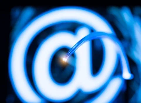 Optical fibres dinamic flying from deep on technology background Stock Photos