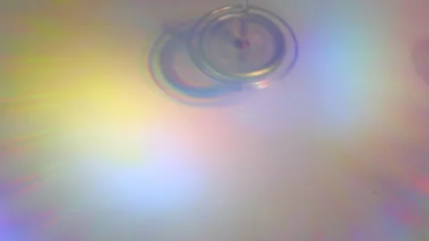 Optical Illusion in Motion: Iridescent Gyroscope with a 3D Effect Stock Footage 302942592