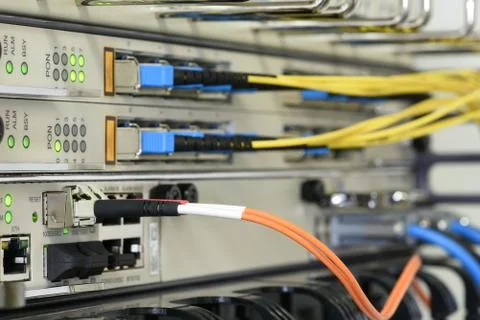 Optical network cables and devices in technology Stock Photos