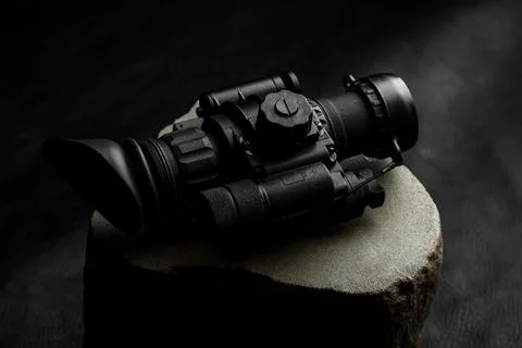 Optical night vision scope on black background Stock Photos