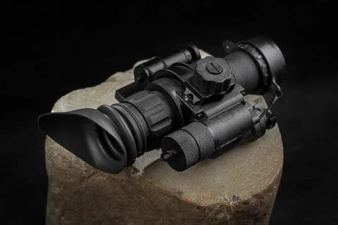 Optical night vision scope on black background Stock Photos