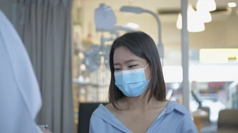 Optical shop concept of 4k Resolution. The ophthalmologist is measuring the c Stock Footage 144622546