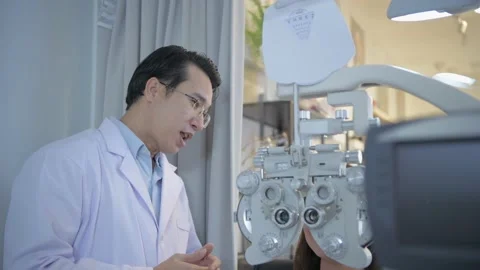 Optical shop concept of 4k Resolution. The ophthalmologist is examining the p Stock Footage 144622566