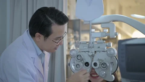 Optical shop concept of 4k Resolution. The ophthalmologist is examining the p Stock Footage 145729969