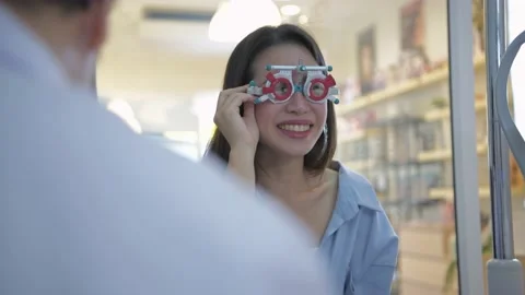 Optical shop concept of 4k Resolution. The ophthalmologist is measuring the c Stock Footage 146549110