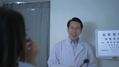 Optical shop concept of 4k Resolution. The ophthalmologist is measuring the c Stock Footage 146549142