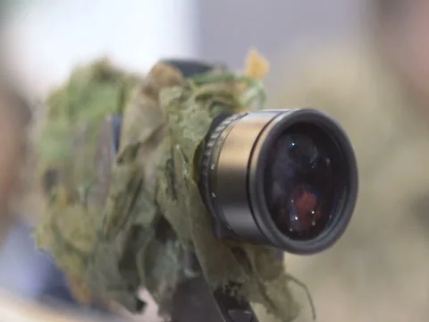 The optical sight of a sniper rifle, optics, weapons, close up 60 fps Video stock 84688323