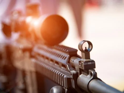 Optical sight on weapons close-up (danger, goal, terrorism - concept) Stock Photos