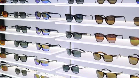 Optical store with technological models of sunglasses. Glasses with polarized Stock Footage 257573571
