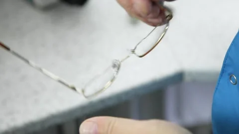 Optician master makes eye glasses Stock Footage 89663776