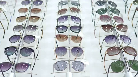 An optics store with many different glasses. Glasses are on the shelves for sale Stock Footage 159481178