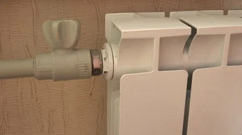 Optimal Setting of the Thermostat Valve. Radiator Adjustment to Save Energy. Rad Stock Footage 49135904