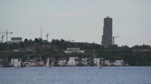 Optimist dinghys navigating calm waters near in Stockholm, Sweden Stock Footage 295911943