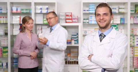 Optimistic Doctor Looking Camera Pharmacist Man Customer Woman Talk Background Stock Footage 67989763