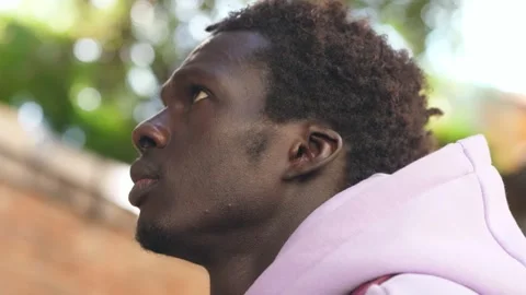 Optimistic Gaze: Man Embraces Future with Hopeful Look Video stock 265859872