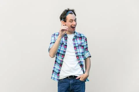 Optimistic glad excited man makes gesture with fore finger upwards, having great Stock-Fotos