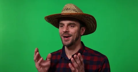 Optimistic Handsome Farmer Man Talking Looking Sideways Green Screen Background Stock Footage 77046533