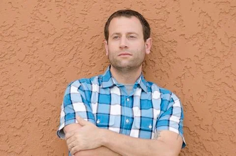 Optimistic man with arms crossed. Stock Photos