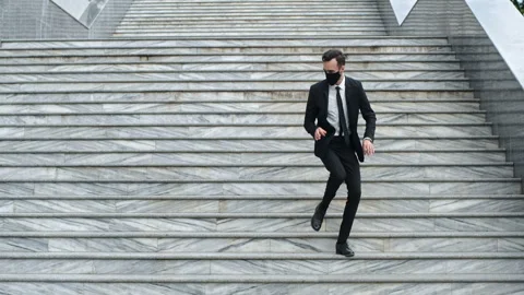 An optimistic man in a black mask Stockbeeldmateriaal 136891205