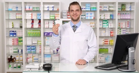 Optimistic Pharmacist Man Holding Tablet Pills Showing Ok Sign Pharmacy Concept Stock Footage 73587766