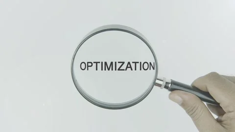 Optimization text or word highlighted by a magnifying glass in a hand Video stock 303681959