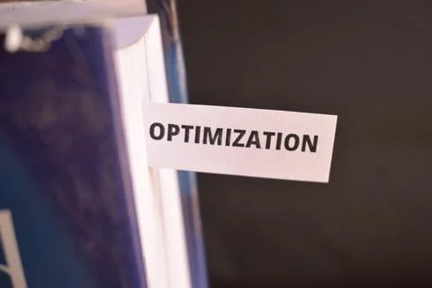 Optimization Text on Paper Bookmark Inserted in Book with Copy Space Backgrou Stock Photos
