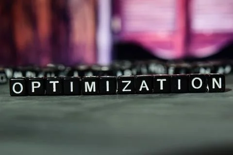 Optimization on wooden blocks. Cross processed image with bokeh background Stock Photos