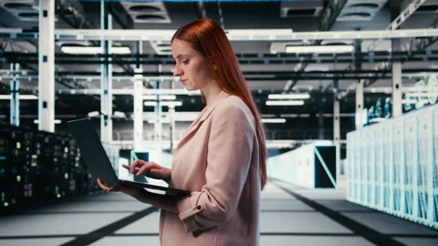 Optimizing electronics, laptop and woman in server farm Video stock 330204778