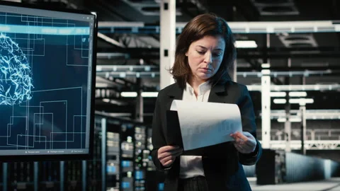 Optimizing equipment rigs, AI and smiling engineer in data center Stock Footage 330099115