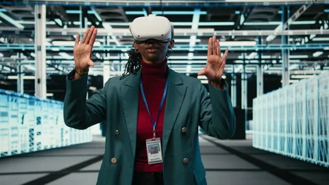 Optimizing gear rigs, VR glasses and female engineer in data center Stock Footage 329591977
