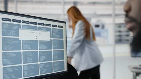 Optimizing microchip production, PC software and technician in factory Stock Photos