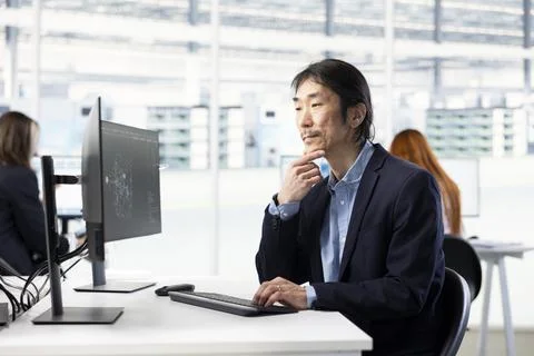 Optimizing PCB production, AI and senior technician in factory research office Stock Photos