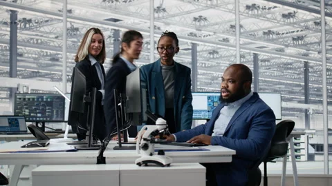 Optimizing production, microchip and multiracial men with women in factory Video stock 335881200