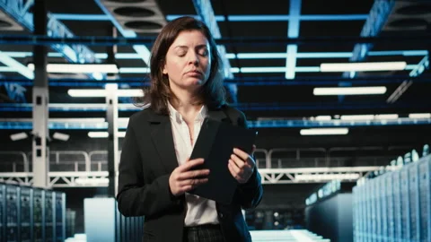 Optimizing server load, VFX compositing and female programmer in data center Stock-Footage 329329992