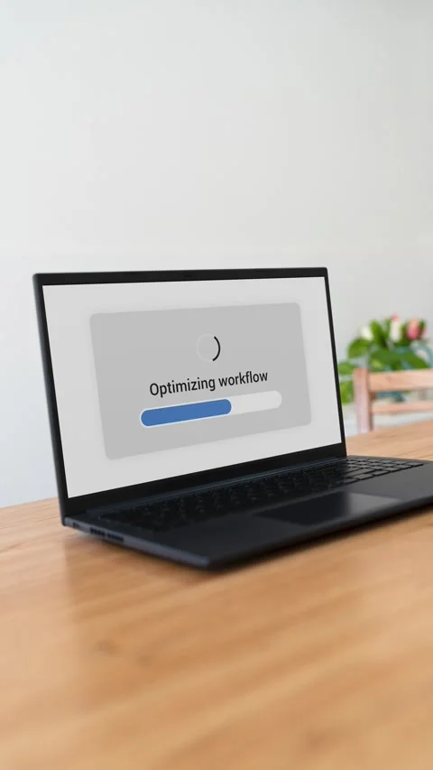 Optimizing workflow with AI on a laptop. Vertical shot. Stock Footage 310334473