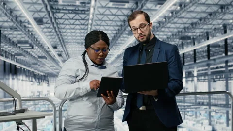 Optimizing workflow, microchips and woman with coworker using EDA software Stock Footage 333384800