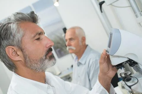 An optometrist doing vision testing Stock Photos