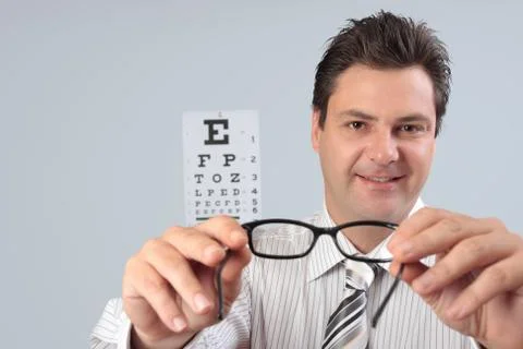 Optometrist holding eye frames Stock Photos