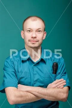 Optometrist with ophthalmoscope, instrument to look into eyes by doctor on blue Stock Photos