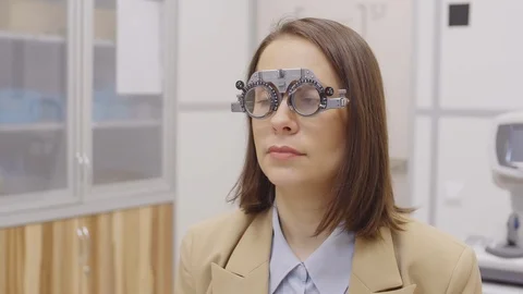 Optometrist Testing Eye Vision of Female Patient Video stock 125082825