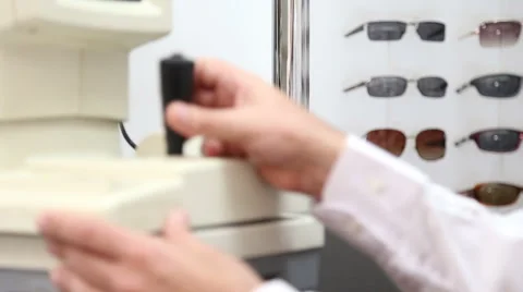 Optometrist uses air puff test Stock Footage 64014336