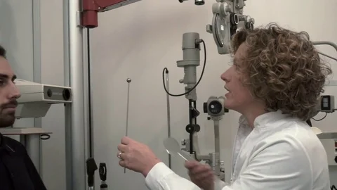 Optometrist visiting his patience Stock Footage 70678045