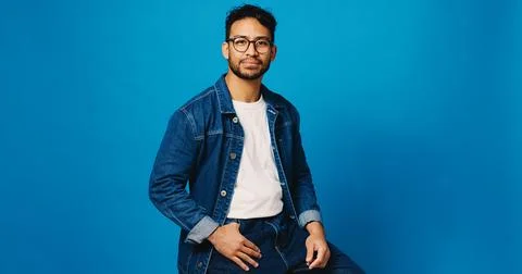 Optometry, blue background and portrait of man with glasses for prescription Stock Photos