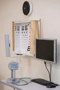 Optometry clinic interior with Snellen chart eye test, computer monitor, an.. Stock Photos