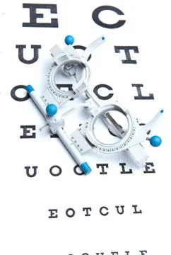 Optometry concept - sight measuring spectacles &amp; eye chart Stock-Fotos
