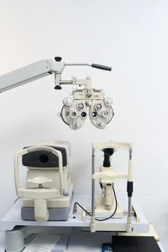 Optometry equipment performing vision testing and eye exam Stock Photos