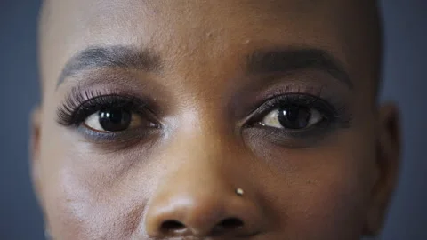 Optometry, eye care and face of black woman in studio with contact lenses for Stock Footage 331184246